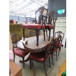 Reproduction mahogany extending dining table plus eight shield-back chairs to include two carvers