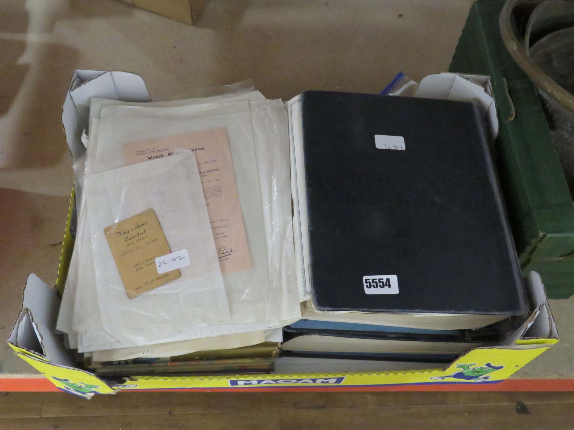 Box containing childrens and adult novels plus ephemera and stamp albums