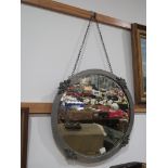 Circular bevelled mirror in pewter frame