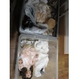 2 boxes containing porcelain dolls