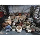 Cage containing studio pottery bowls and mugs