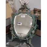 Shield shaped table mirror in decorative metal frame