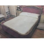 French style sleigh bed with red upholstery