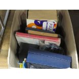 Box containing a quartz clock, movie reels and games