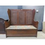 Oak upholstered settle