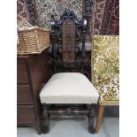 Carved oak dining chair with cream upholstered seat