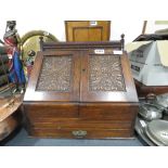 Oak stationery cabinet with carved panels
