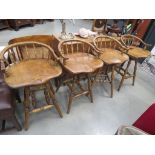 Set of 4 elm seated swivel stools with shaped seats