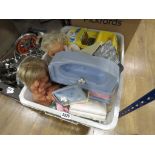 Plastic tub containing dolls and childrens toys