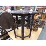 Carved octagonal Indian table with folding base