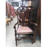 Dark oak highback armchair with pink embroided seat