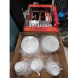 Box containing blank type cassettes and white glassed crockery
