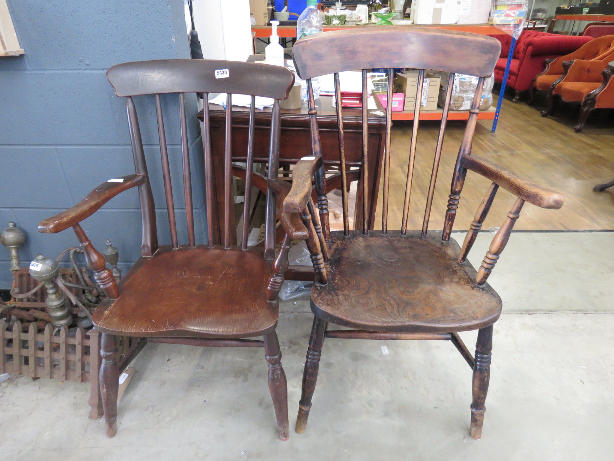 Two elm seated stick-back armchairs