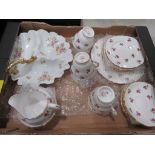 box containing Colclough rose patterned crockery