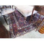 Multi-coloured woolen Oriental carpet with floral pattern