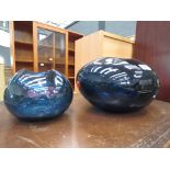 2 blue glass vases