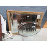 Two bevelled wall mirror and a large rectangular mirror