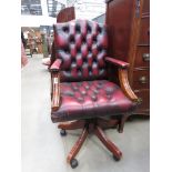 Red leather effect Chesterfield style swivel office chair