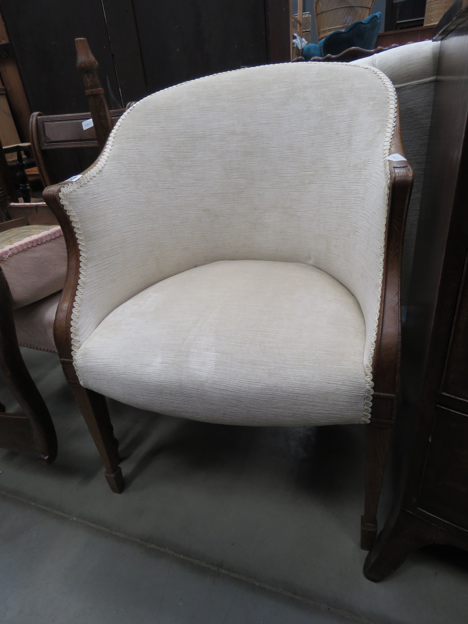 Cream upholstered oak tub chair