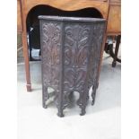 Heavily carved oak octagonal side table