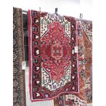 (13) Red mat with geometric and floral pattern