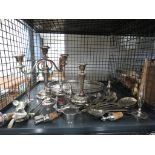 Cage containing silver plate to include a 3 branch candlestick plus one other, salt and pepper