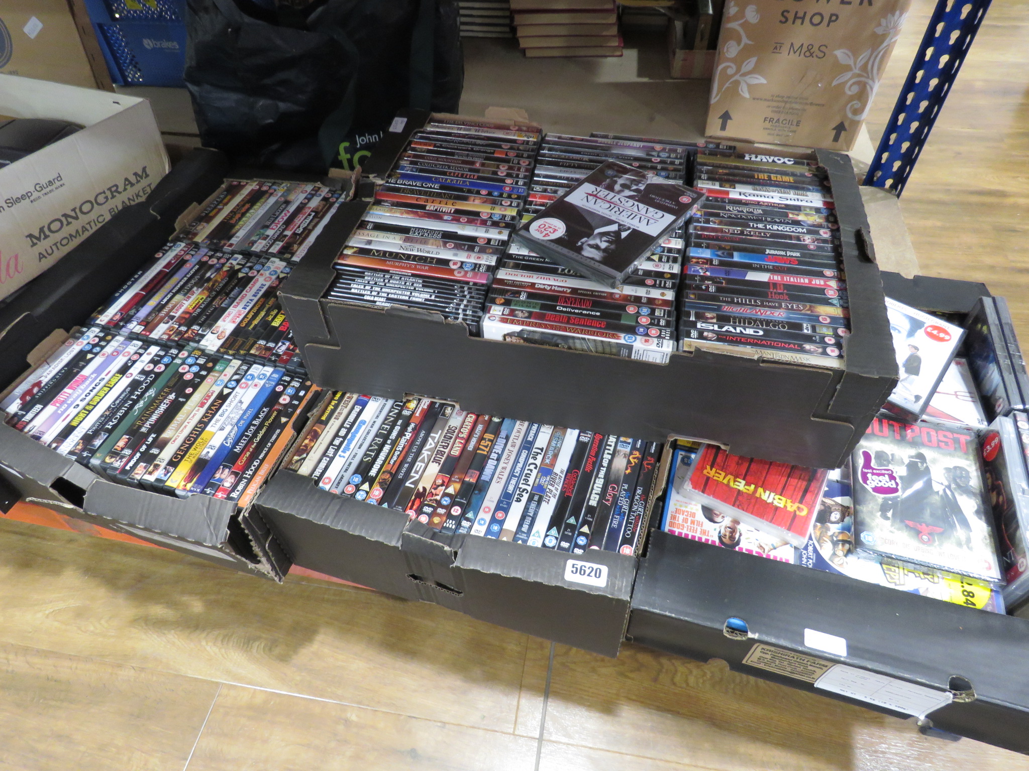 4 boxes containing a large quantity of DVD's