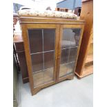 Oak bookcase with glazed and leaded doors