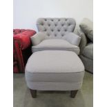 Grey fabric easy chair with button up back and matching footstool