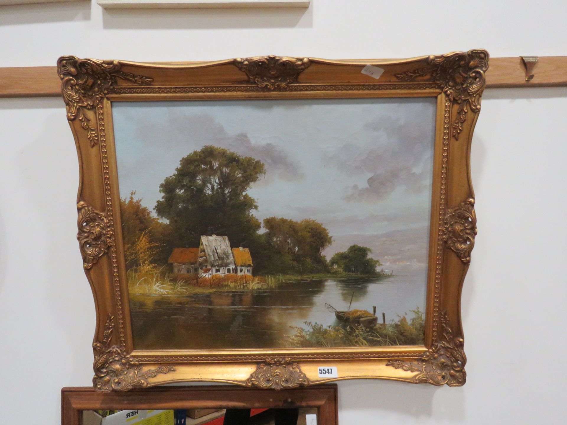 Modern oil on canvas of a lake with fishing boat and cottages in background