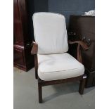 Adjustable Parker Knoll oak 1930's arm chair with cream cushions