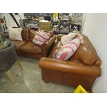 Pair of tan leather two seater sofa with scatter cushions