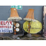 A pair of amber glass and metal table lamps with brown suede shades