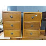 Pair of oak three drawer bed side cabinets