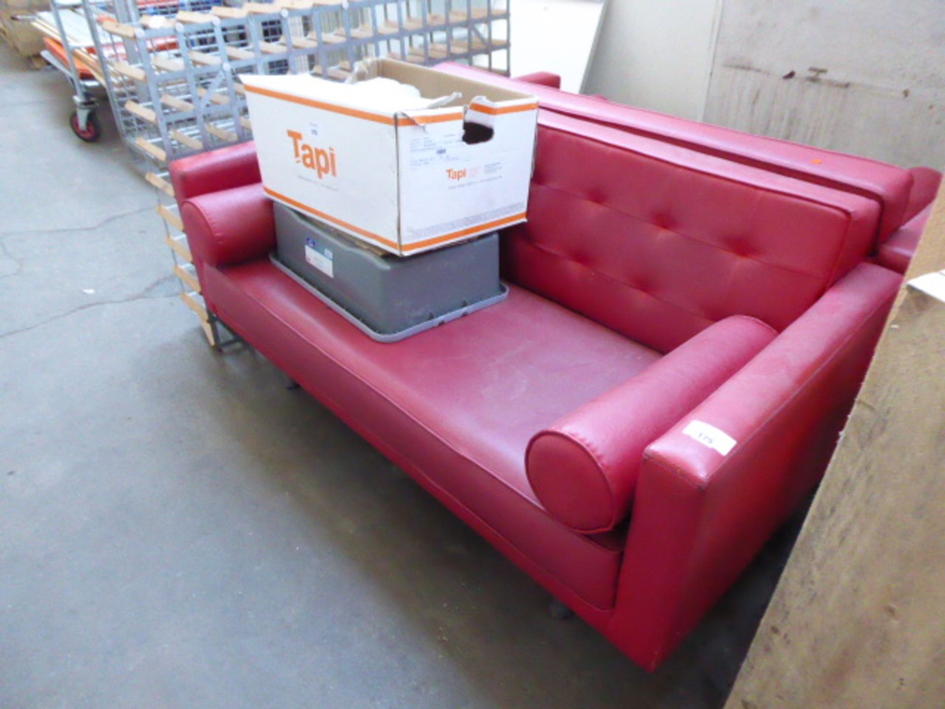 2 large red leather effect sofas