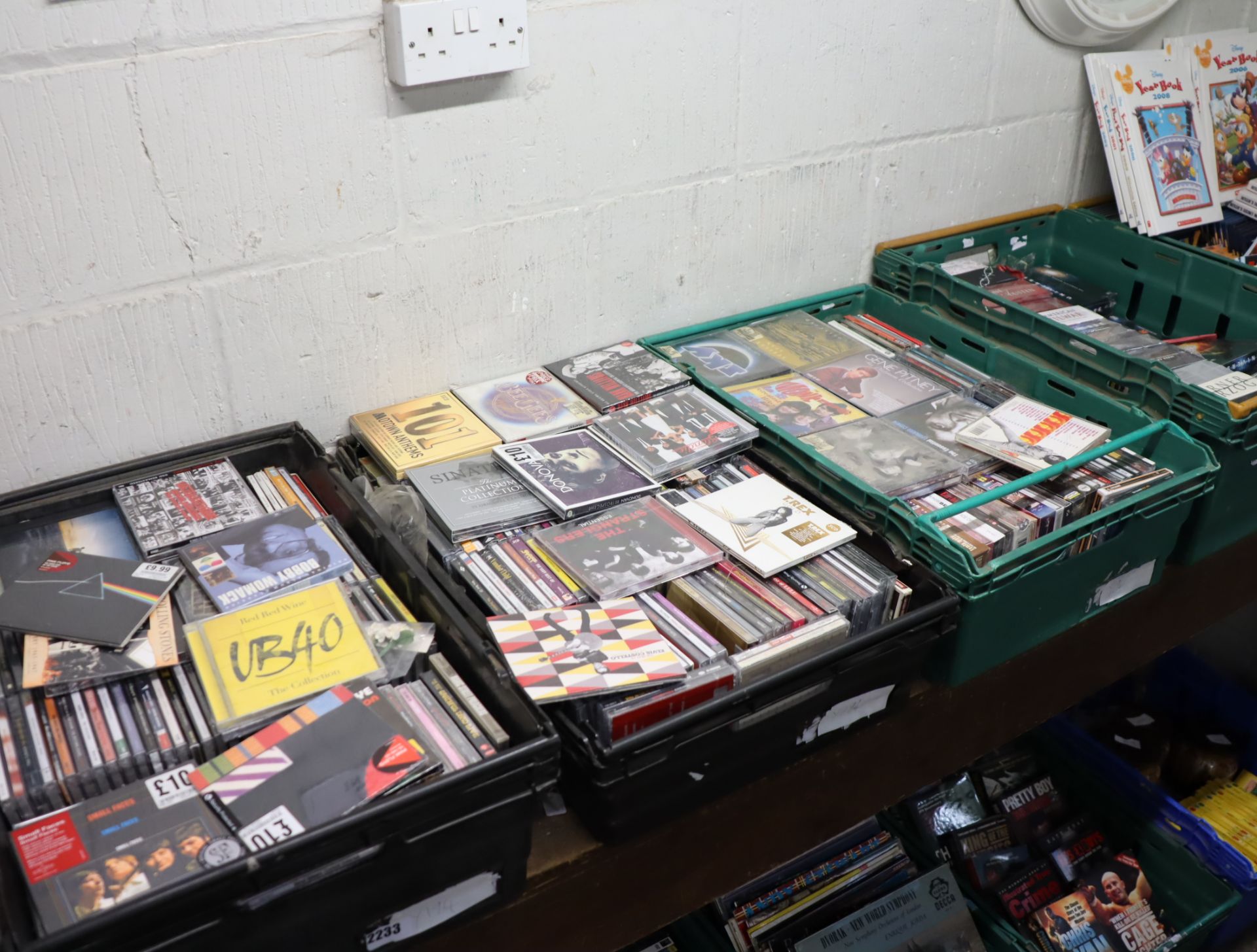 3 crates containing mainly sealed CDs incl. UB40, Pink Floyd and Frank Sinatra with crate of DVDs