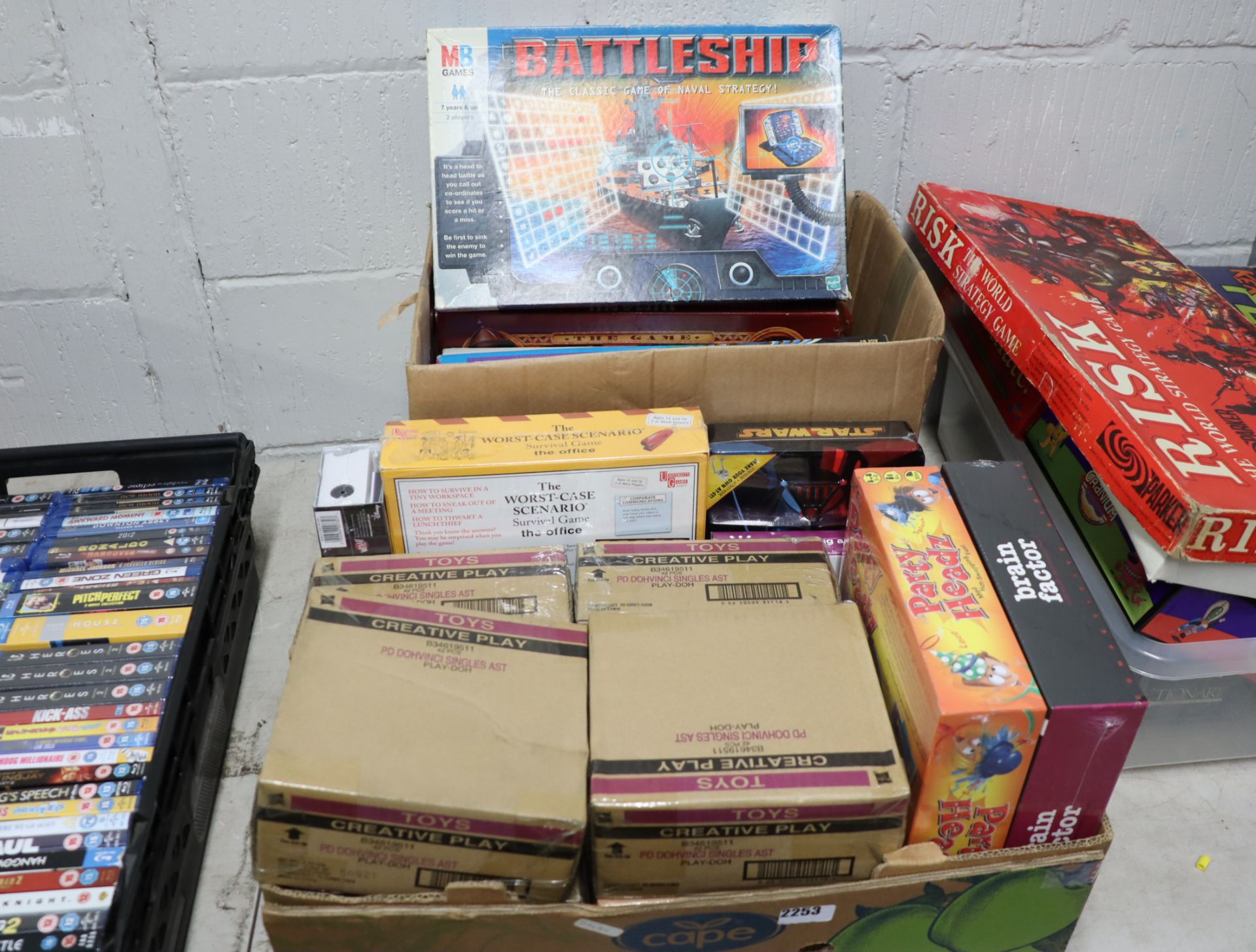 Box of board games incl. Battleship and Jumanji with box containing creative play toys, Star Wars