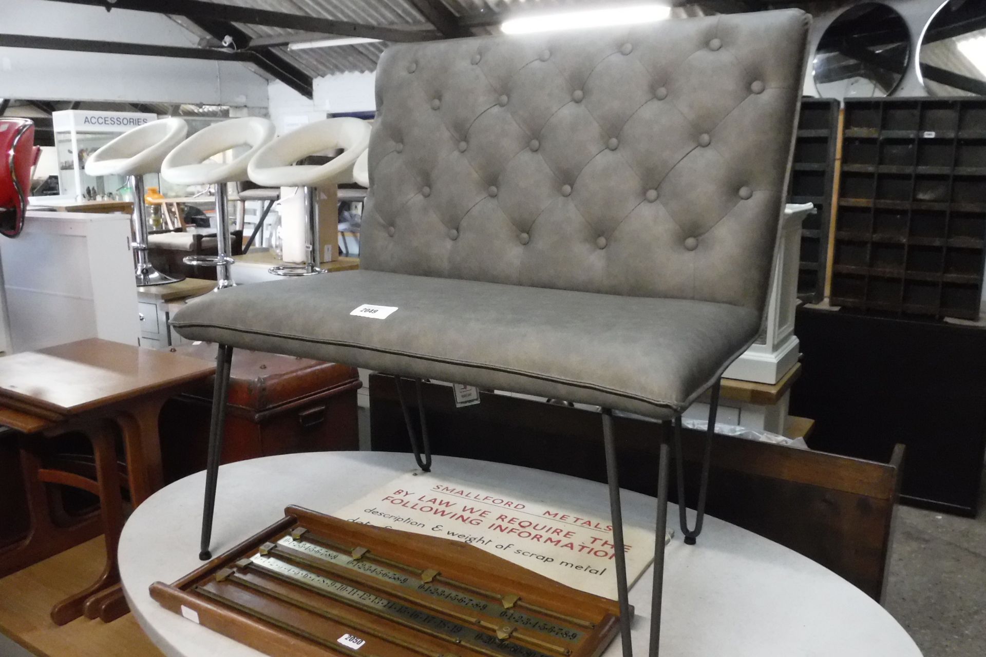 Grey leatherette button back bench on metal tapered legs