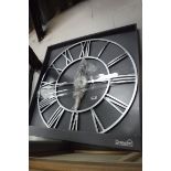 Large silver Roman numeral style wall clock