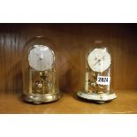 Pair of glass dome clocks