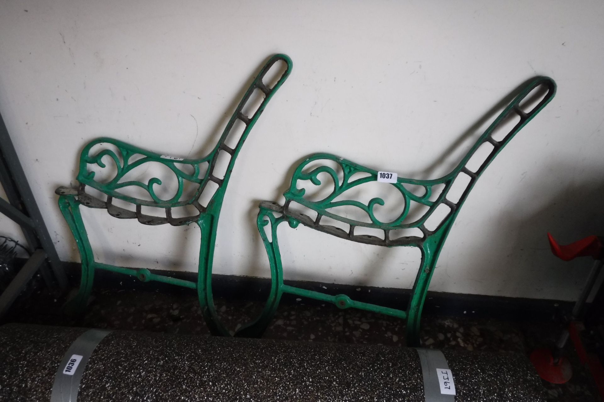 Pair of green metal bench ends