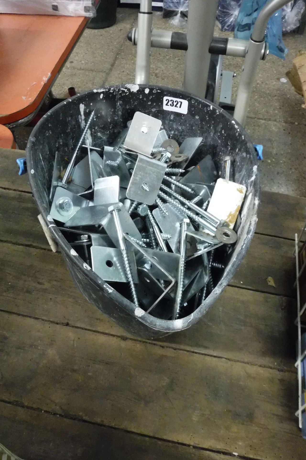 Bucket of screws and brackets