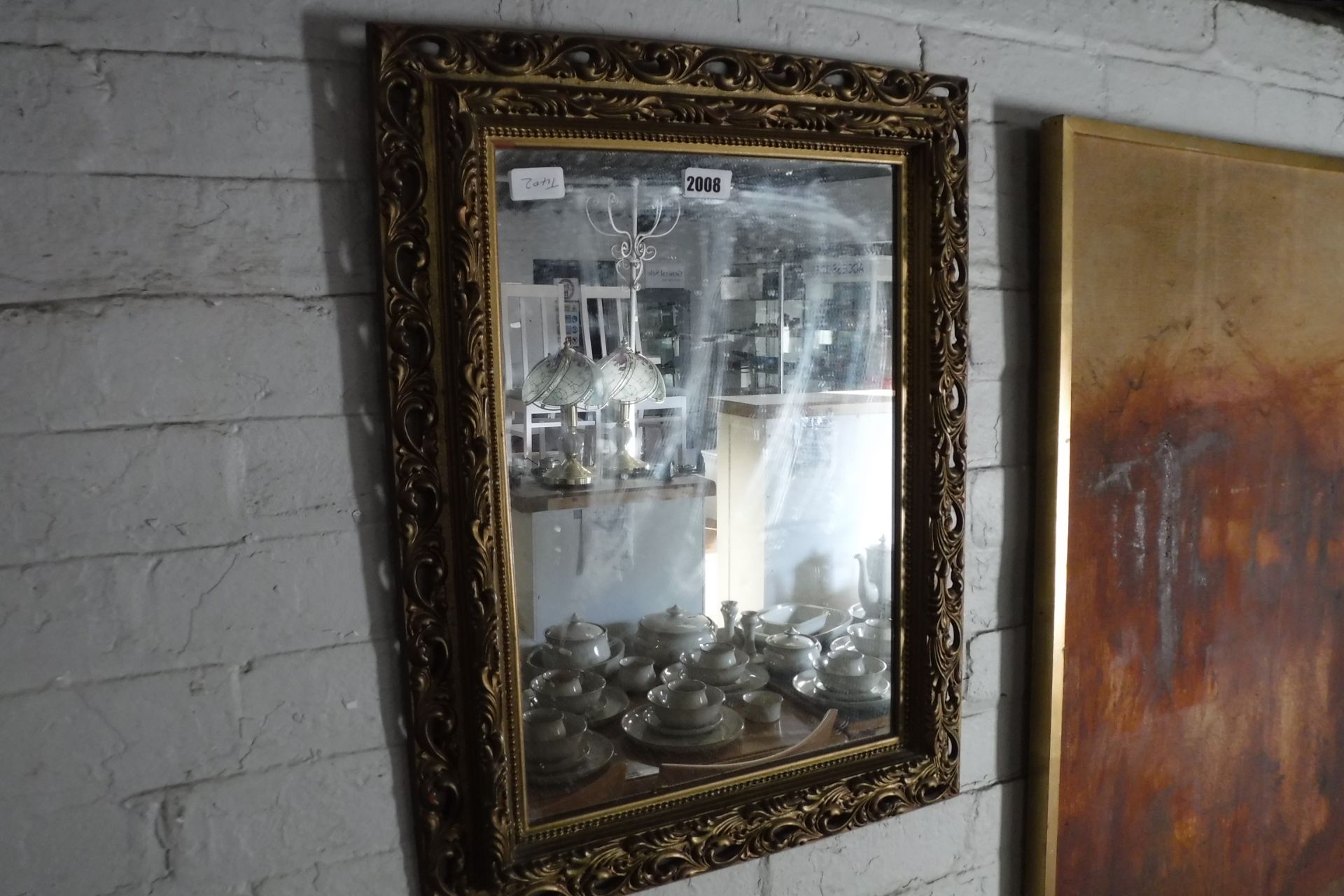 Gilt and leaf decorated mirror