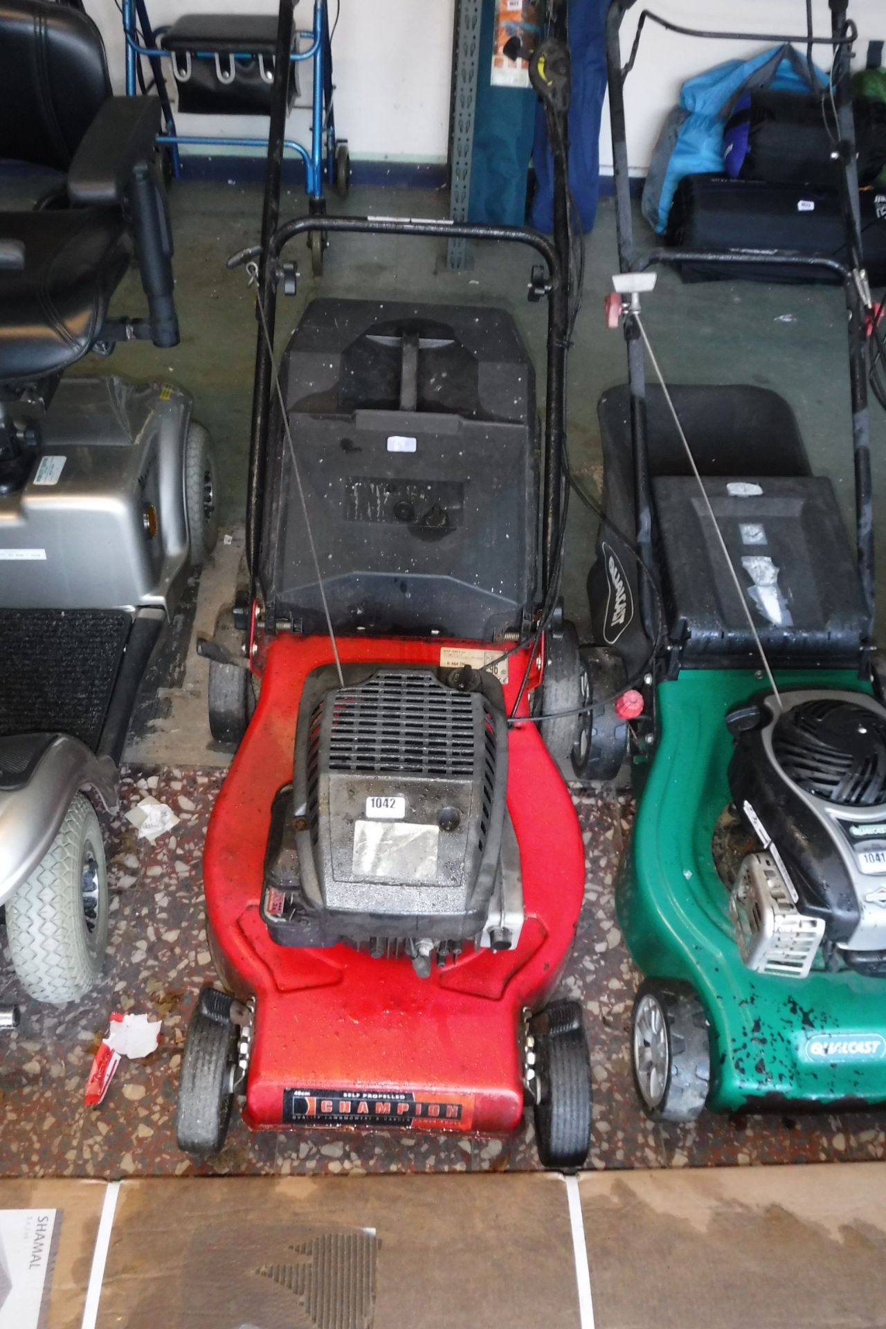 Champion self propelled petrol lawnmower with grass box