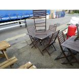 Wooden square topped folding garden table, with 4 matching chairs