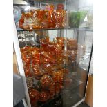 Large collection of Carnival glass and lustreware (on 4 shelves)