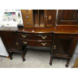 Mahogany sideboard with central drawers and cupboards