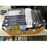 Box of various jigsaw puzzles