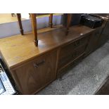 Oak sideboard with central drawers flanked by cupboards