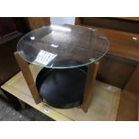 Circular glass topped occasional table with shelf under